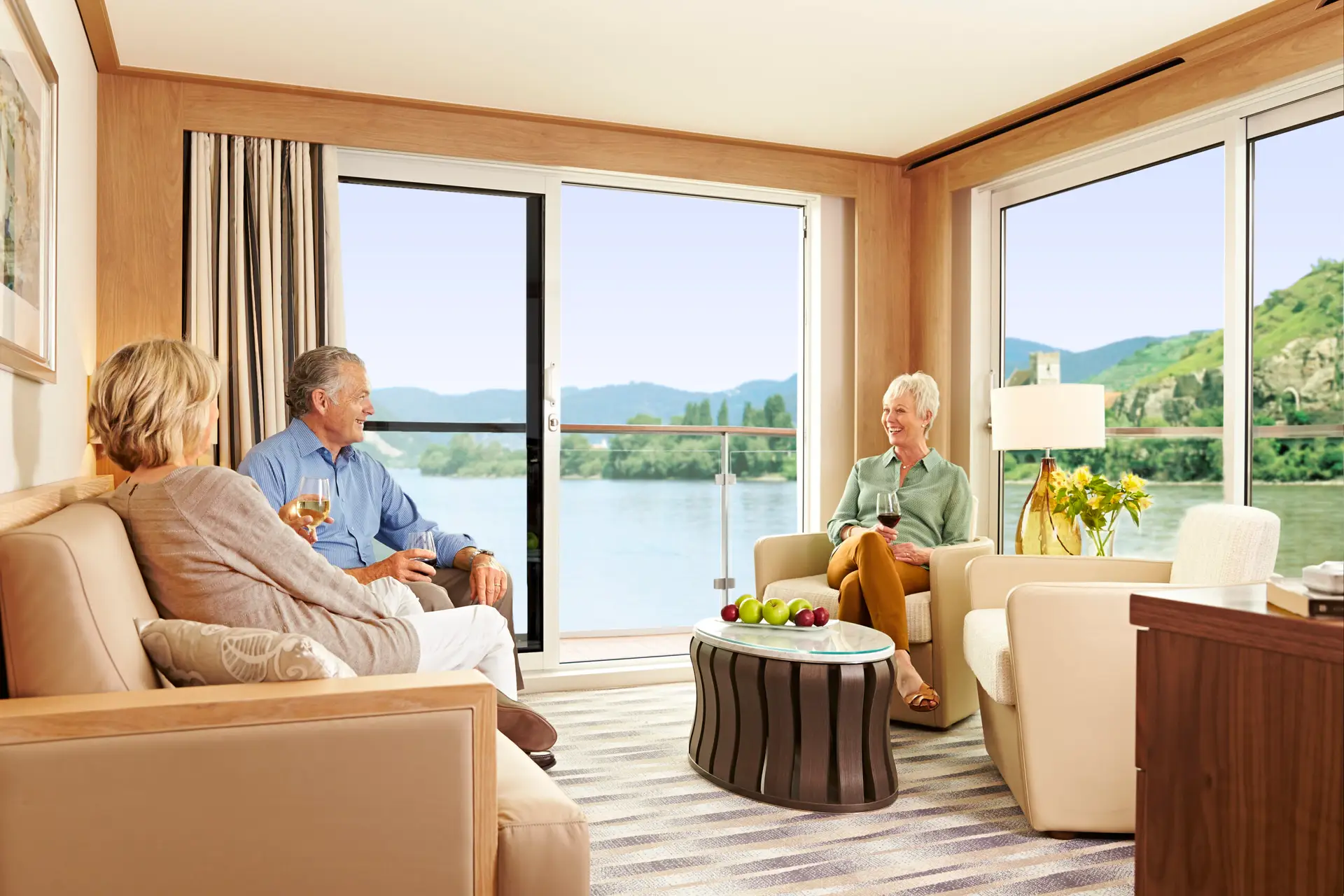 Guests relaxing in a Explorer Suite onboard a Viking Longship.