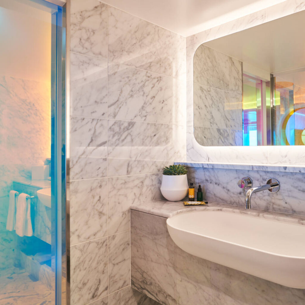 Suite bathroom sink and shower view.